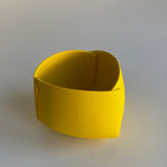 291. YELLOW OBJECT BY ANN VAN HOEY